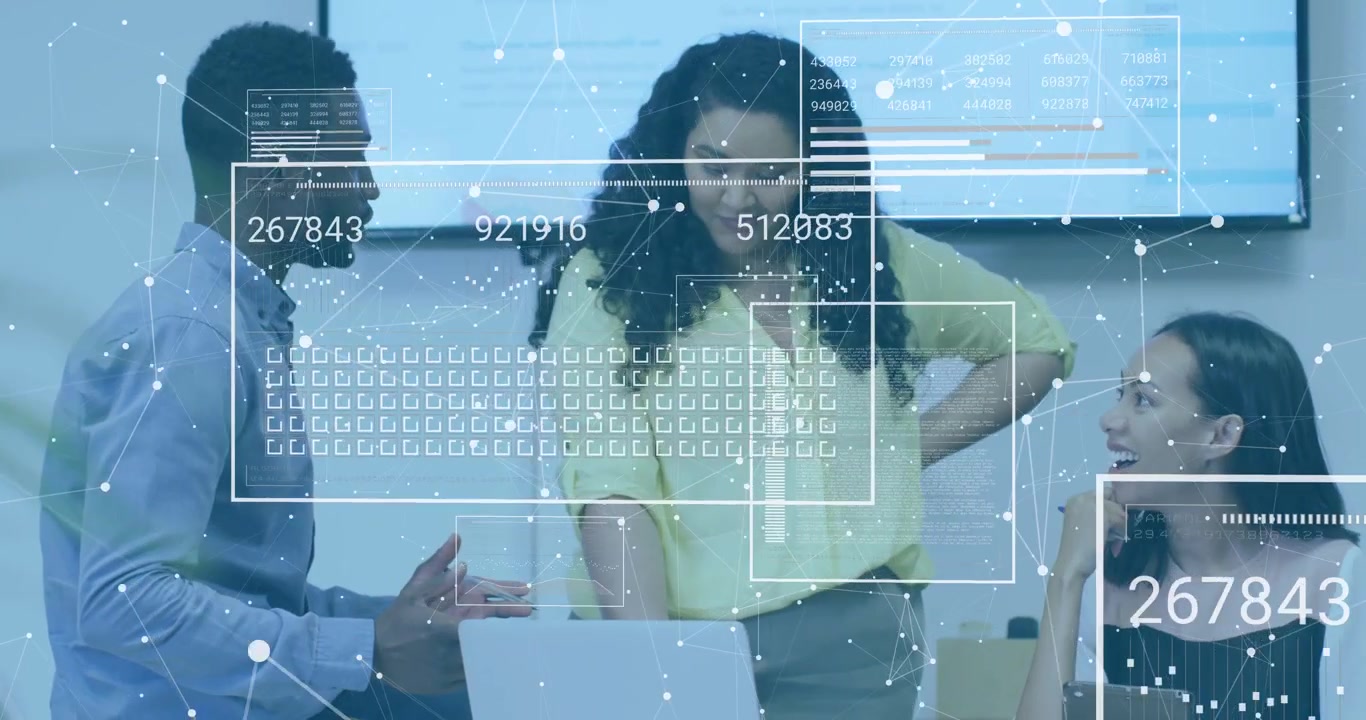 Three team members around laptop, man gesturing, causing data overlays for business review