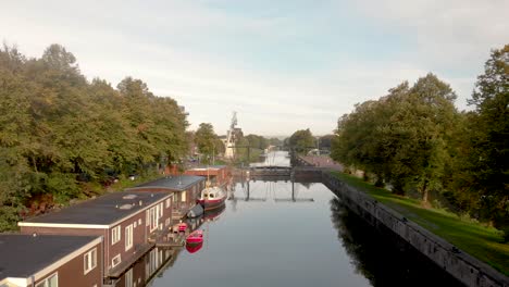 Former-industrial-area-and-transportation-canal-in-the-city-of-Utrecht-now-reformed-into-a-green-neighbourhood-with-floating-houses,-recreational-areas-and-bike-path