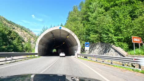 entering and driving through a mountain tunnel