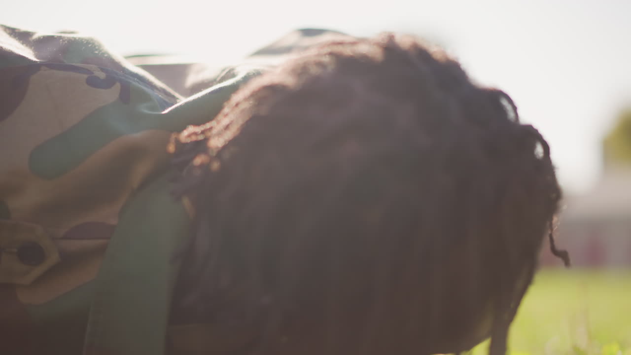 Military Trainee In Outdoor Exercise, Recruited Soldier Engaging In Physical Training Beneath Sunlight, Military Recruit Actively Working Out Outdoors With Intense Concentration And Effort