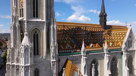 matthias church, budapest: aerial closeup with colorful roof tiles on neo-gothic church