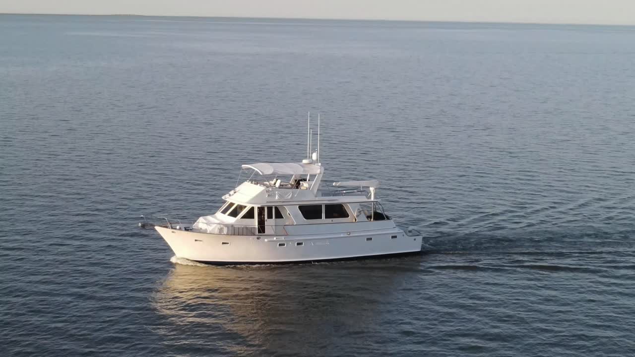 Luxury Yacht Sailing Smoothly In Open Sea On A Sunny Day. wide