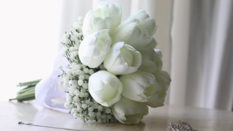 bride's bouquet and accessories on the table for a wedding - camera moving