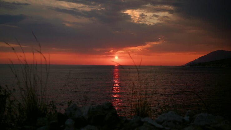 Red sunset over seawater surface