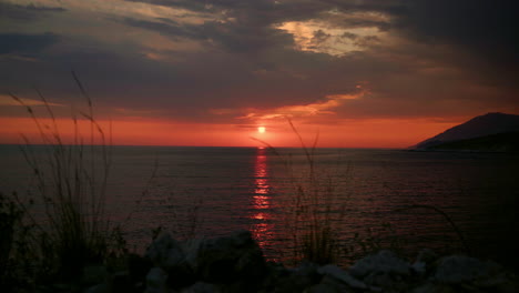 red sunset over seawater surface