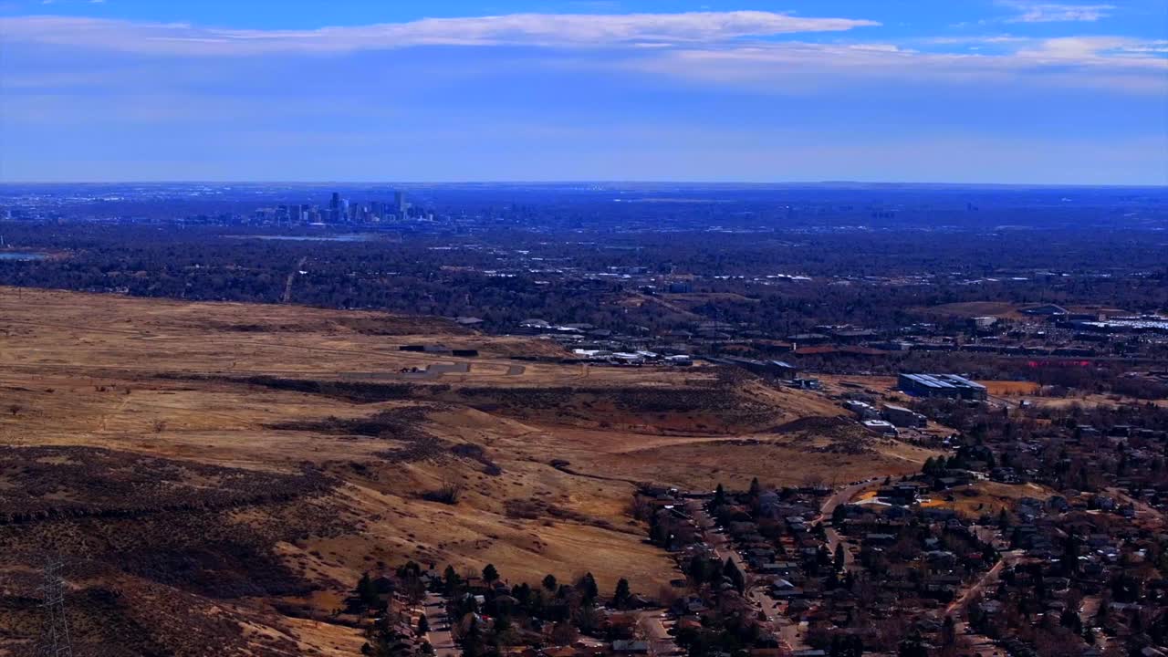 Lookout Mountain Golden Colorado aerial drone Downtown Denver cityscape from North Table Mesa daytime winter sunny clouds neighborhood Front Range Rocky Mountains Arvada Lakewood circle right motion