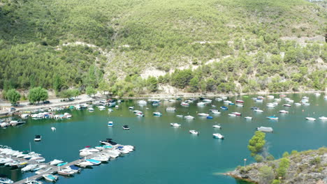 dramatic aerial view over the cliffs and marina at lago de bolarque spain