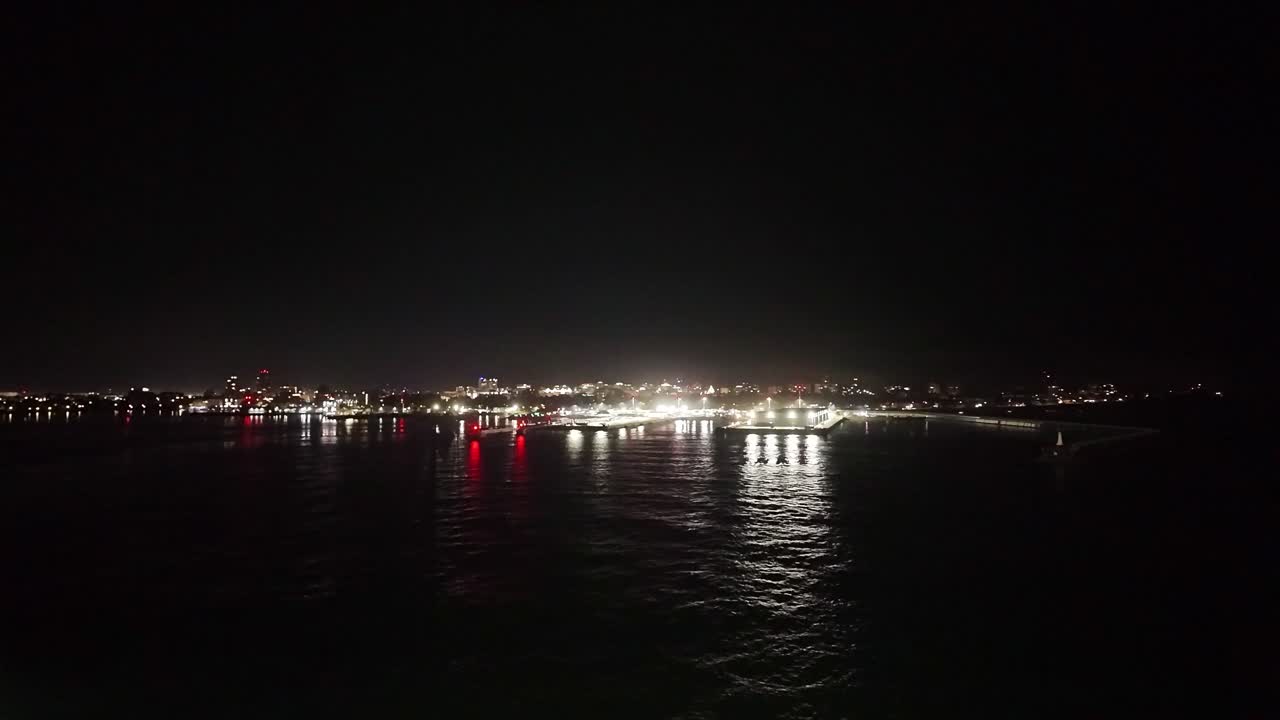 Gimbal super wide shot of Victoria Harbour from the Salish Sea during a rainy night on Vancouver Island in British Columbia, Canada. 4K