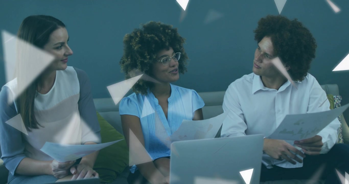 Three colleagues studying charts on laptop with animated triangles guiding business data review