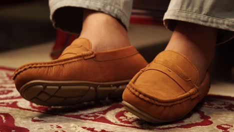 man wearing brown loafers