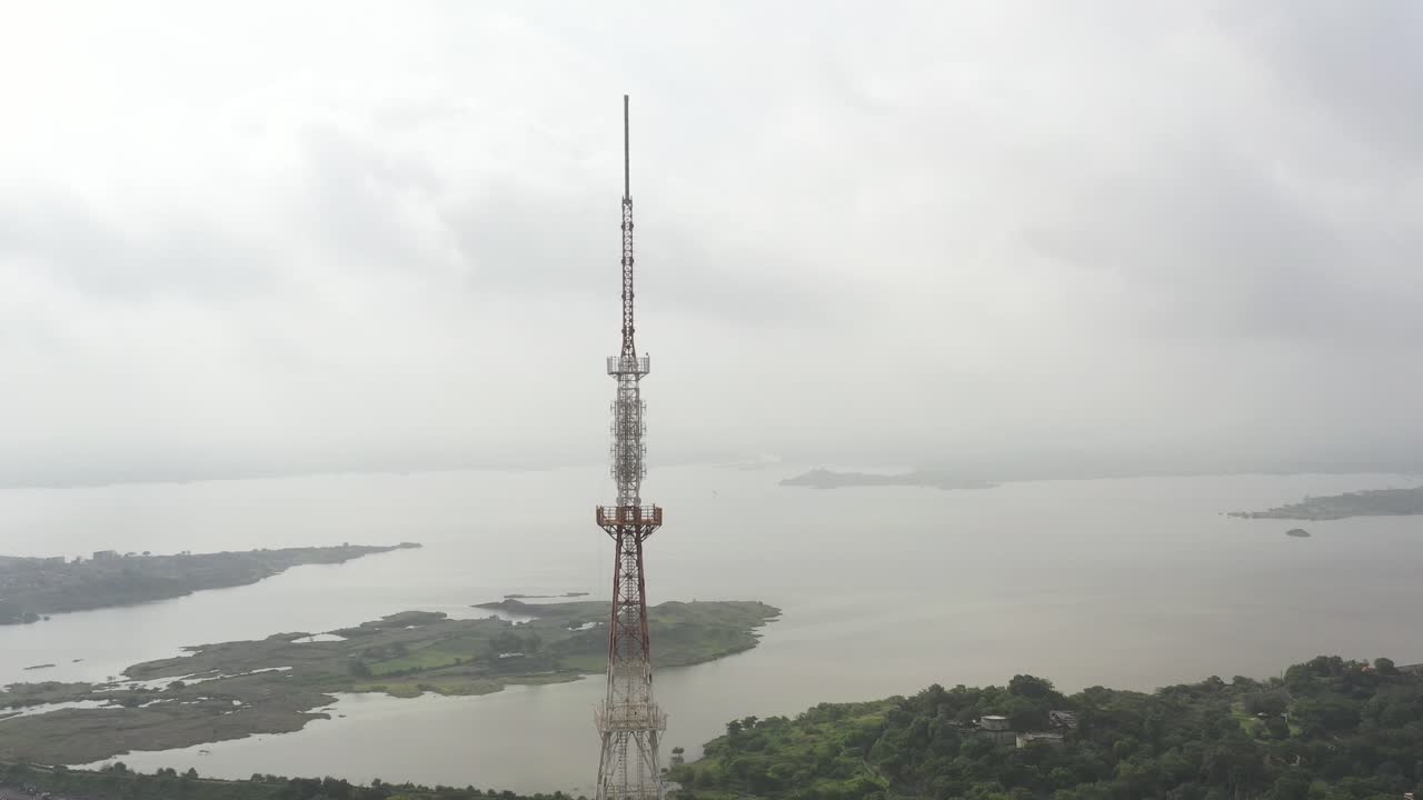 Aerial View of a Communication Tower near a Lake