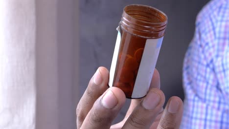 person holding a medicine bottle