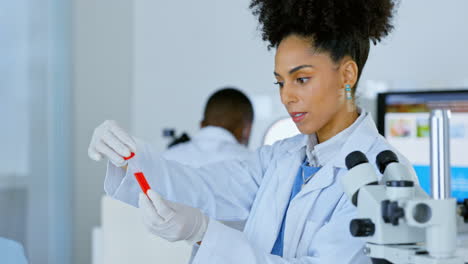 woman, scientist and checking vial sample