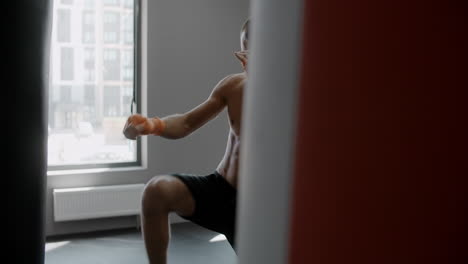 man practicing martial arts in a gym