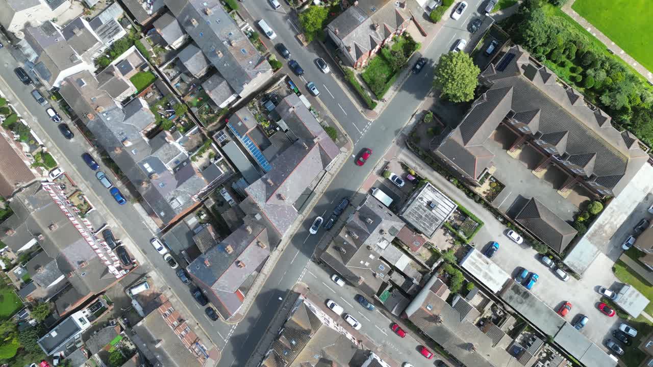 West Kirby suburban coastal town flyover, Wirral, UK - aerial drone, gimbal down