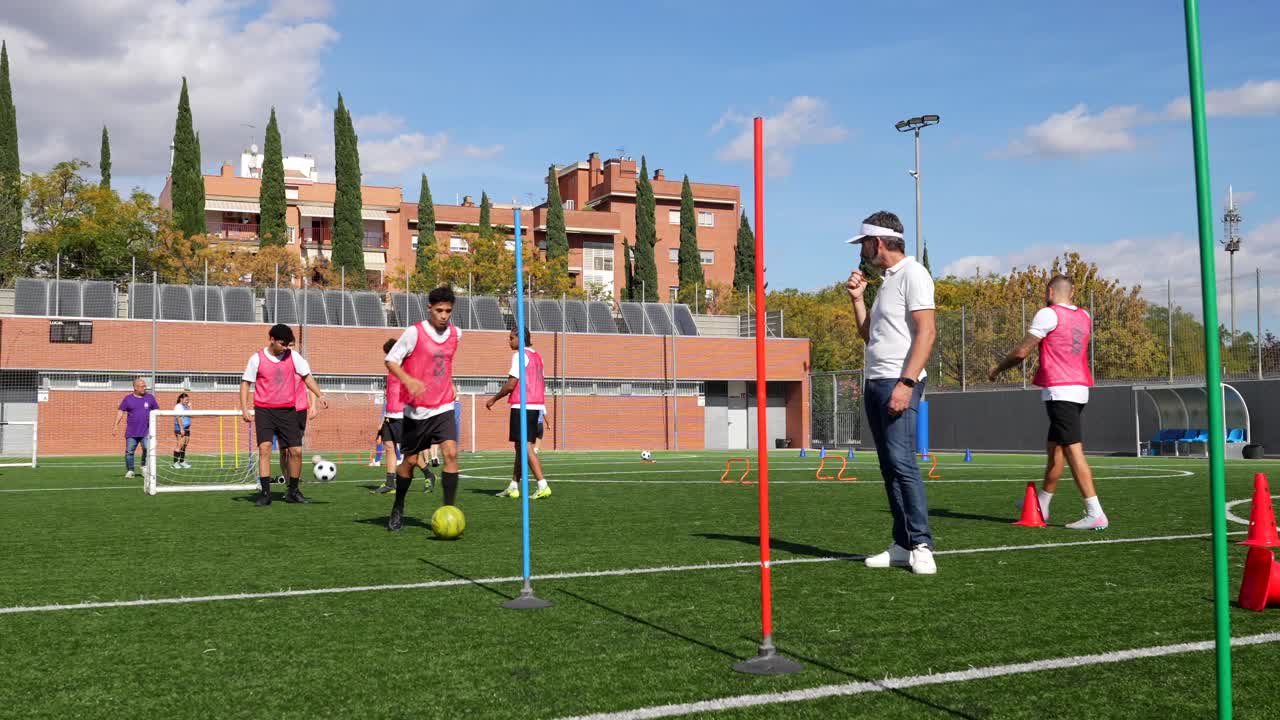 Soccer team training with coach on field