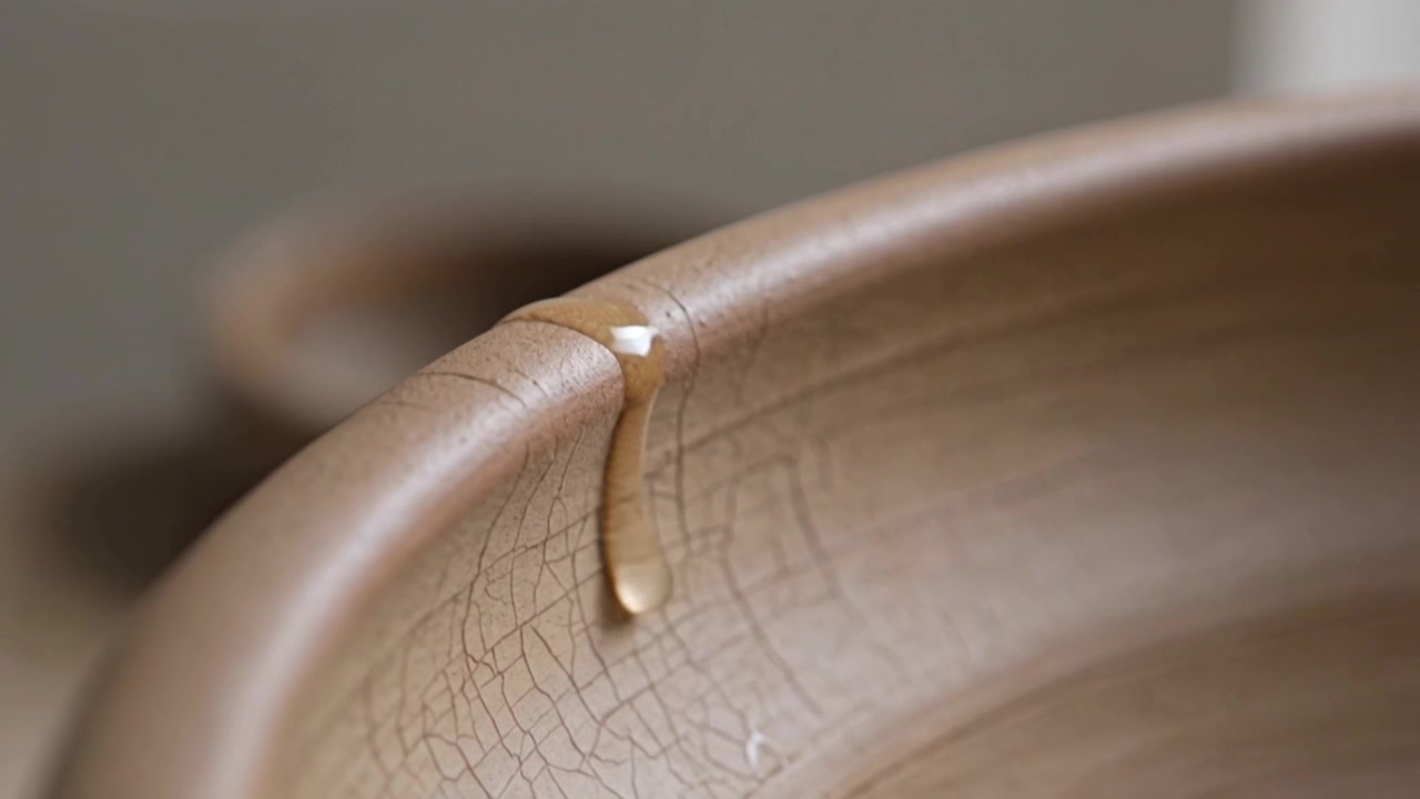 Forming bead at rim seam moving inward on tabletop glazed bowl wall with crackle