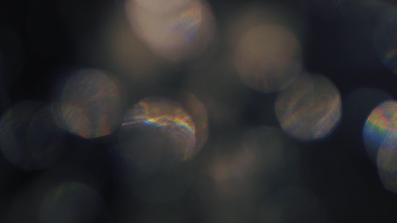 Abstrakte regnbue-lyslækager og bokeh-overlejring