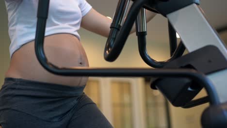 Active-pregnant-woman-exercise-in-fitness-center.