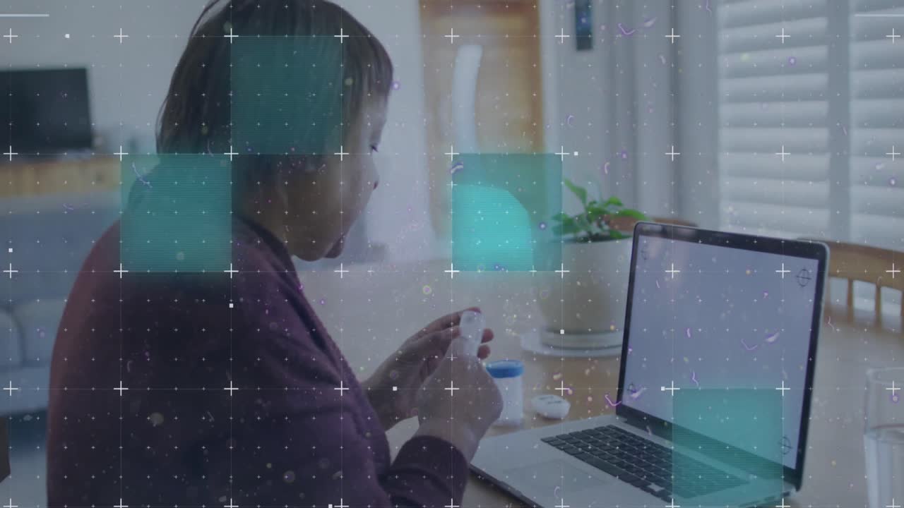 Animation of shapes over african american woman using laptop with copy space