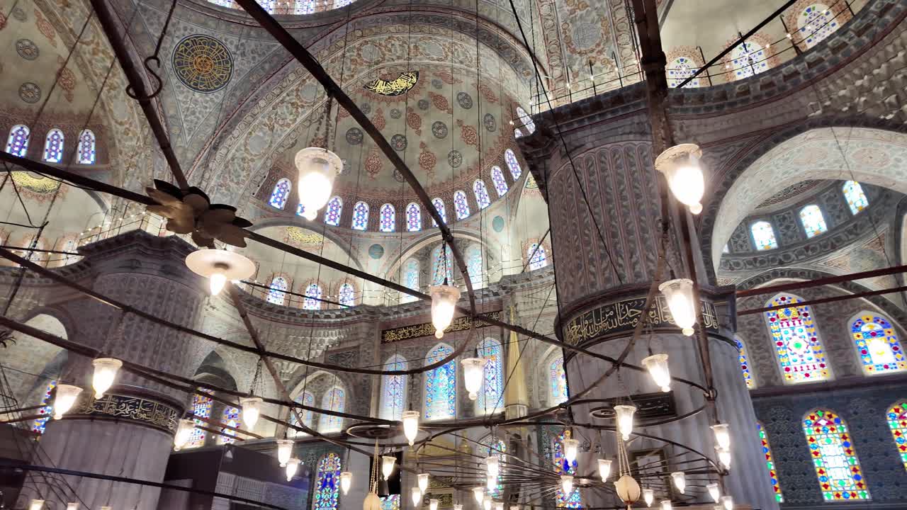 intricate patterns and Arabic script inside the Blue Mosque, Istanbul Turkey