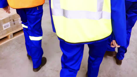 group of warehouse workers walking together