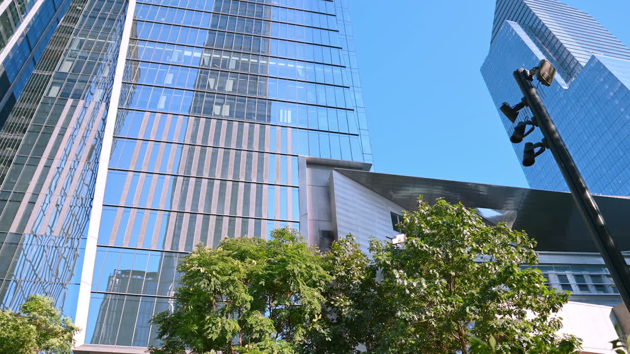 New York, USA, 4 August 2025: Modern skyscraper and Vessel structure at Hudson Yards in New York City. A view of a modern skyscraper and the Vessel structure at Hudson Yards