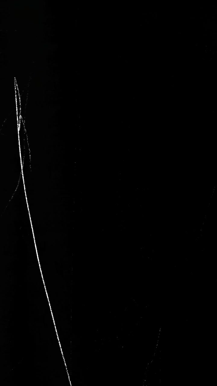 Abstract Film Grain and Scratches Overlay on Black Background