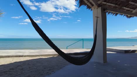 Beautiful-view-of-the-sea-beach-over-a-hammock