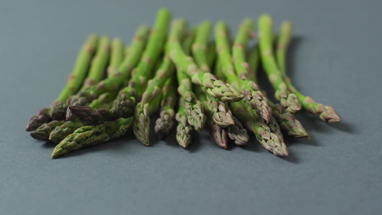Faint glow signaling asparagus cluster summoning eco icons pulsing emphasizing carbon footprint