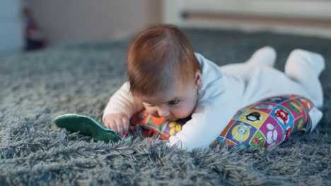 Beautiful-little-baby-girl-lying-on-her-stomach