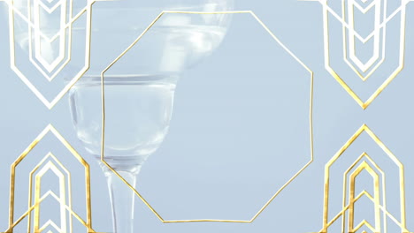 golden frame design pattern over close up of cocktail glass against grey background