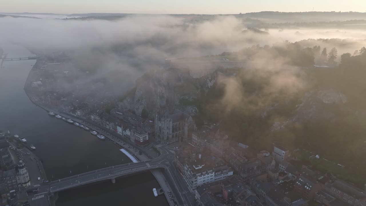 Notre Dame cathedral in Belgium at Dinant city during sunrise, aerial