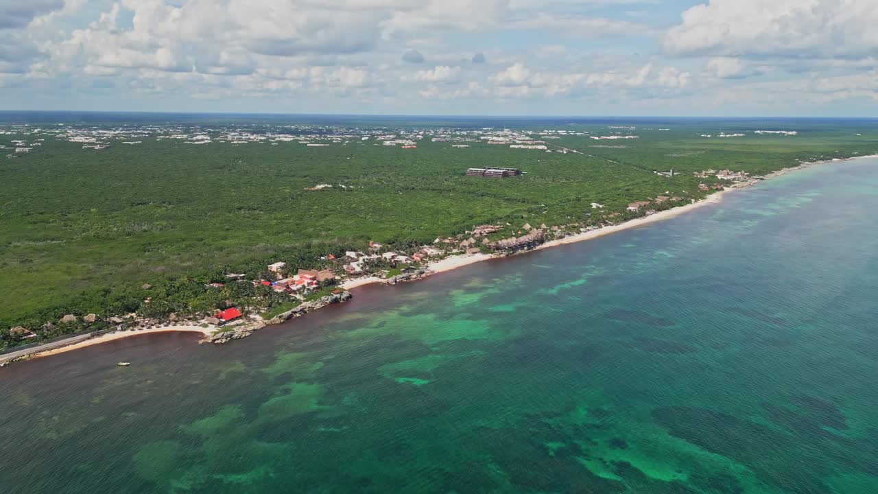 Aerial view of Tulum beach, lush green, tranquil coastal vibe
