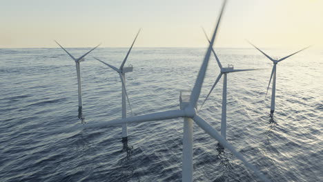 Wind-turbines-generating-alternative-clean-green-energy,-wind-farm-in-the-ocean,-climate-change-solution,-aerial-3d-render