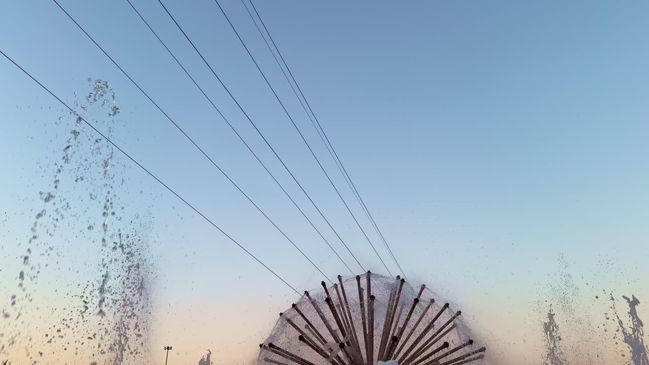 Closeup of multijet fountain against the blue sky