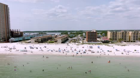 Gulf-Shores,-Alabama-skyline-and-beach-with-drone-video-moving-left-to-right