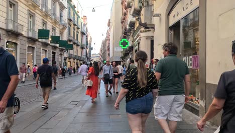 people walking and interacting on a bustling street