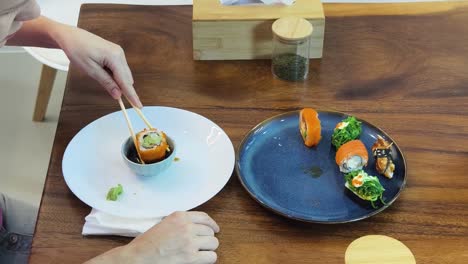 woman eating sushi