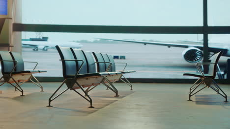 airport waiting area with airplanes