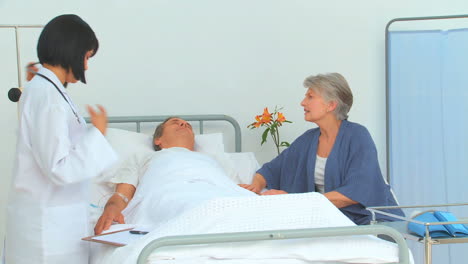 cute asian nurse listening to heartbeat