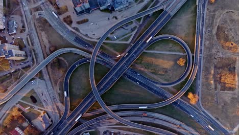 slow-motion aerial descent of riga’s krasta viaduct at golden sunrise light