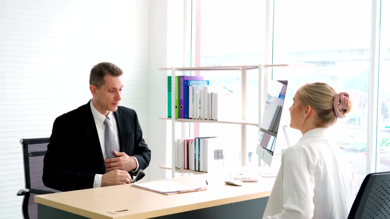 Job seeker and manager handshake in job interview