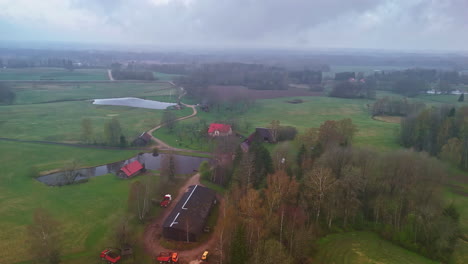 Misty climate in rural parts of Latvian village, Drone shot