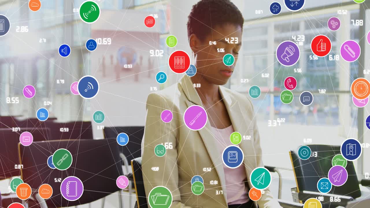 Animation of connected icons with numbers over short hair african american woman working on laptop
