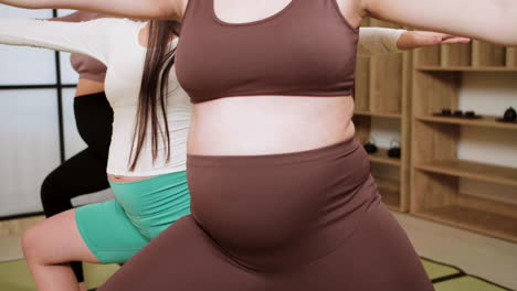 women doing yoga indoors