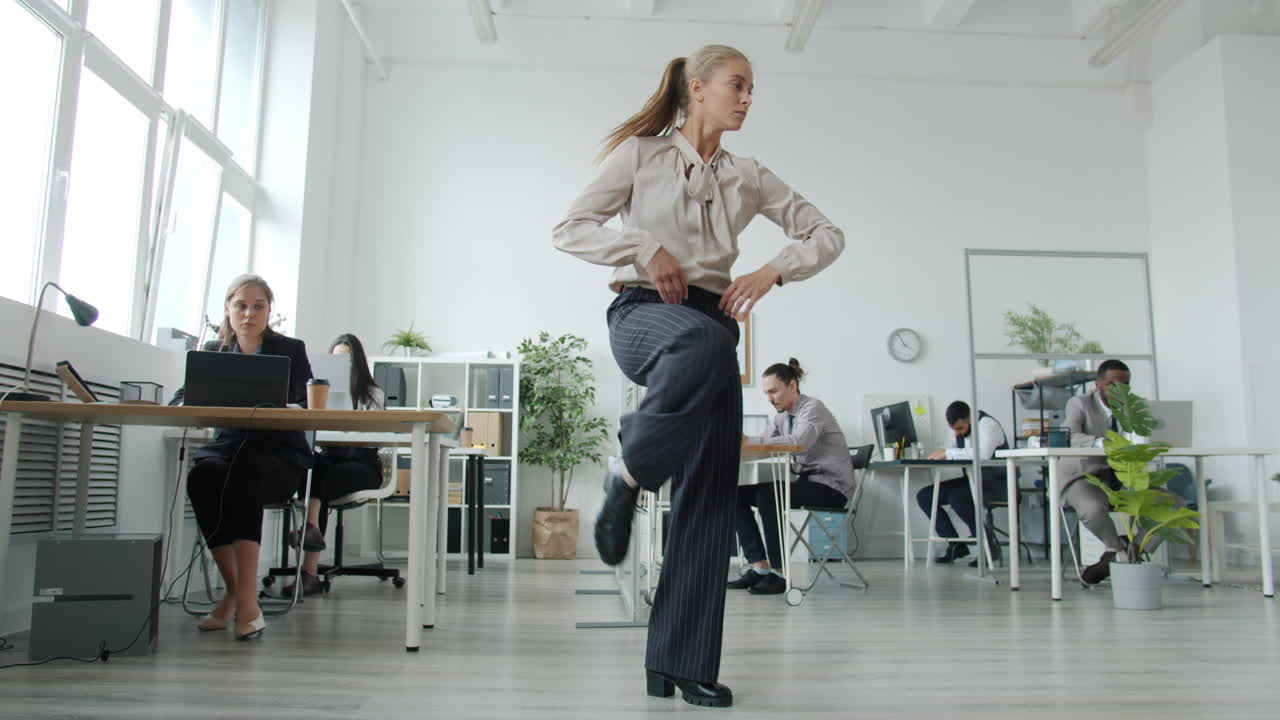 Woman Dancing in a Modern Office
