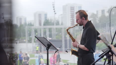 saxophonist playing on a stage