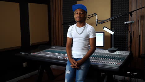 young man in recording studio with sound mixer