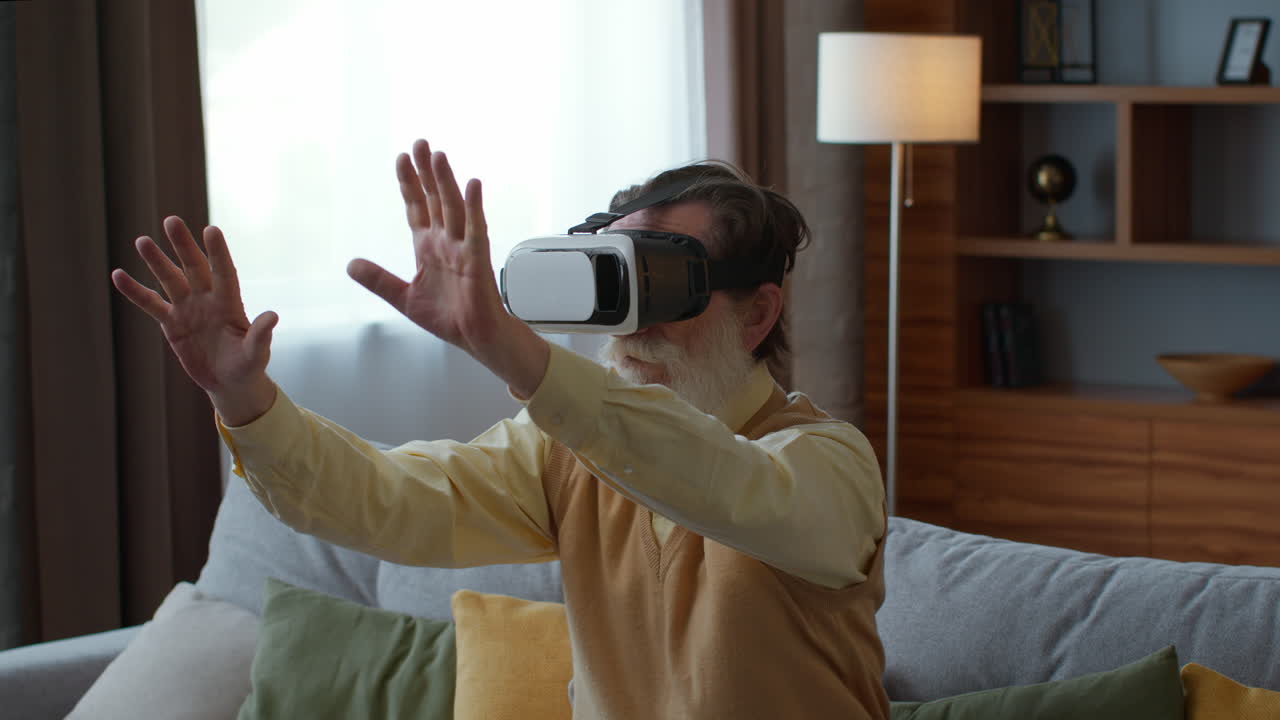 Elderly Man Using VR Headset at Home